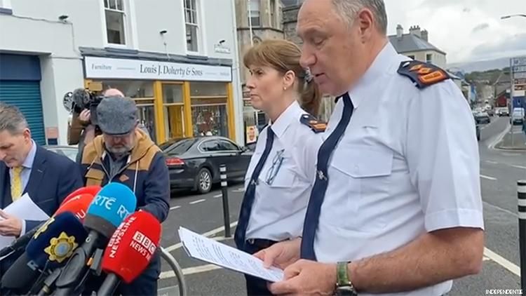 Police at a press conference about the killings