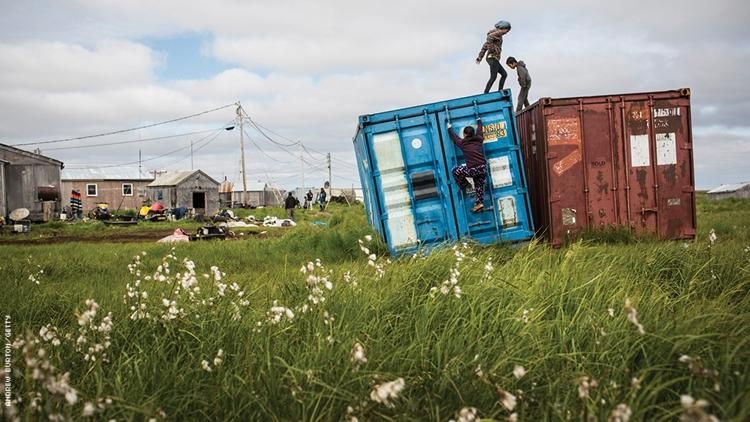youth playing on boxcars