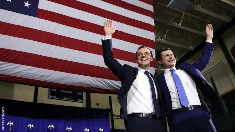 Pete and Chasten Buttigieg embracing.
