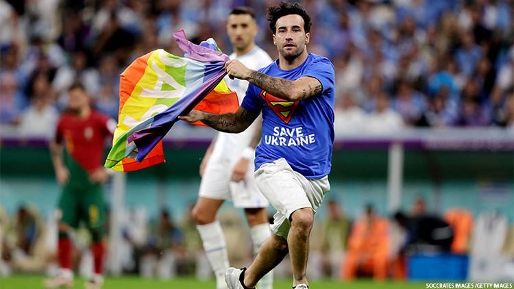 Mario Ferri running with pride flag