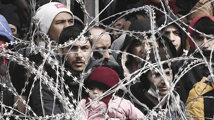 Refugees behind fence