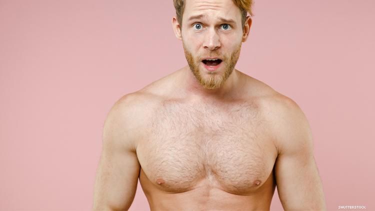 Shocked naked man seen from waist up