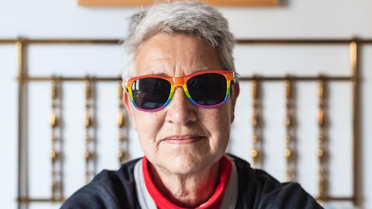 Older woman with rainbow sunglasses
