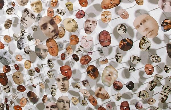 HEAD(S), (detail) mixed media installation, hand cut pigment prints & bank pins, 2012