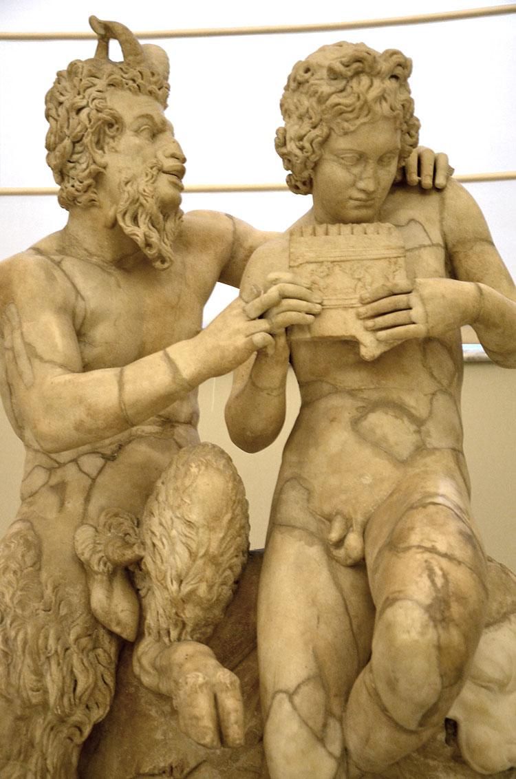 Pan teaching Daphnis to play the flute.