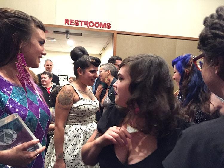 Cristy C. Road, center, who presented the award for LGBT graphic novel, navigates the Skirball's crowded lobby. 