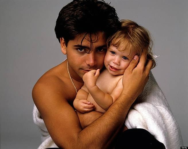 20. Full House's John Stamos cuddles with baby Mary-Kate or Ashley.