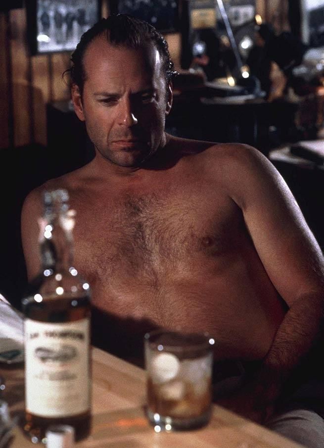 43. Bruce Willis and his dad bod enjoy a drink.