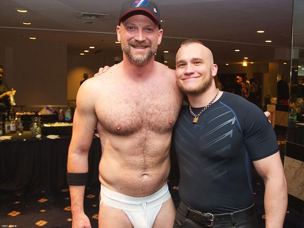 Somebody looks really happy to be cuddling up to the big jock-strapped dad.