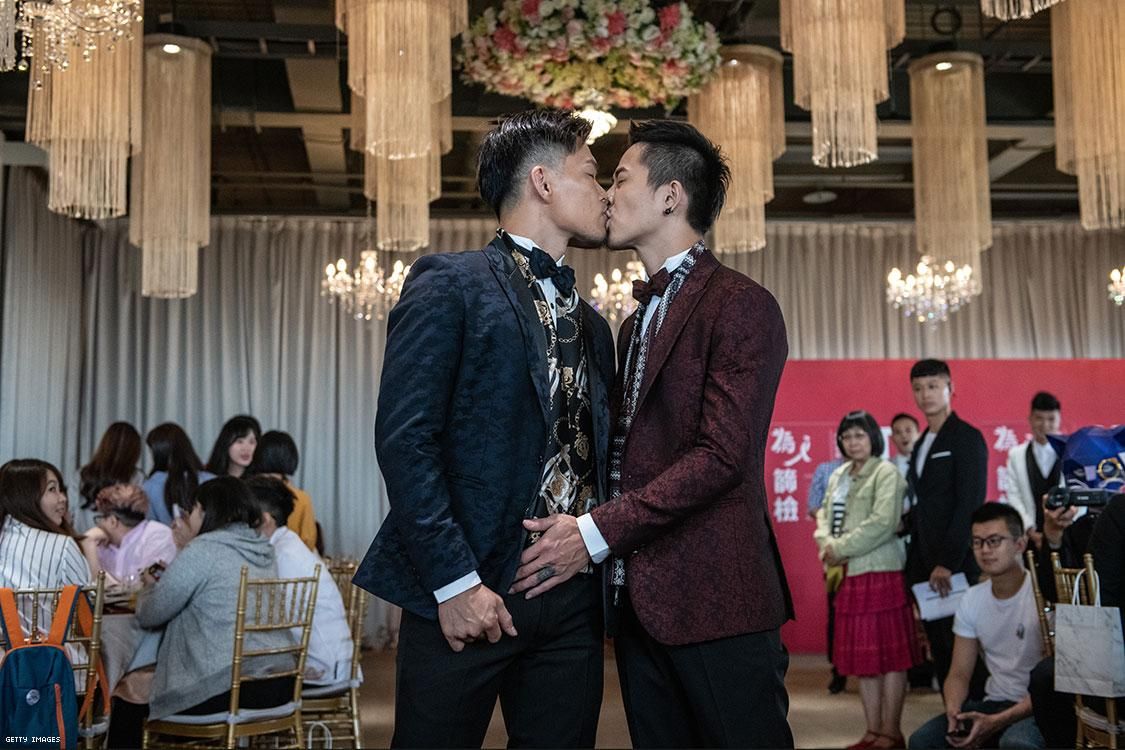 Gay couple A-Tuo (L) and Hsuan Yo kiss
