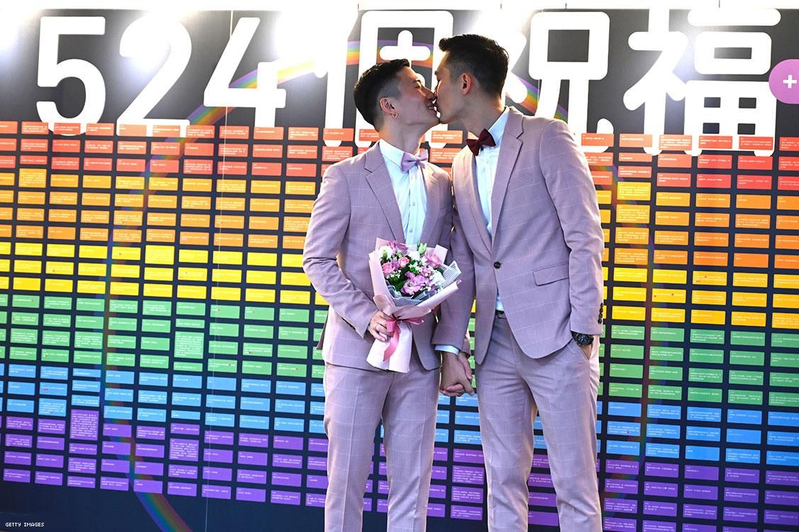 Taiwans first gay couple Shane Lin (L) and Marc Yuan kiss