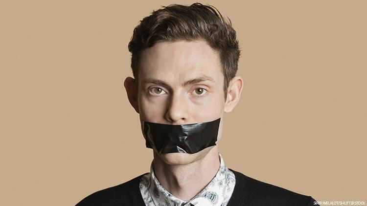 Man with mouth covered