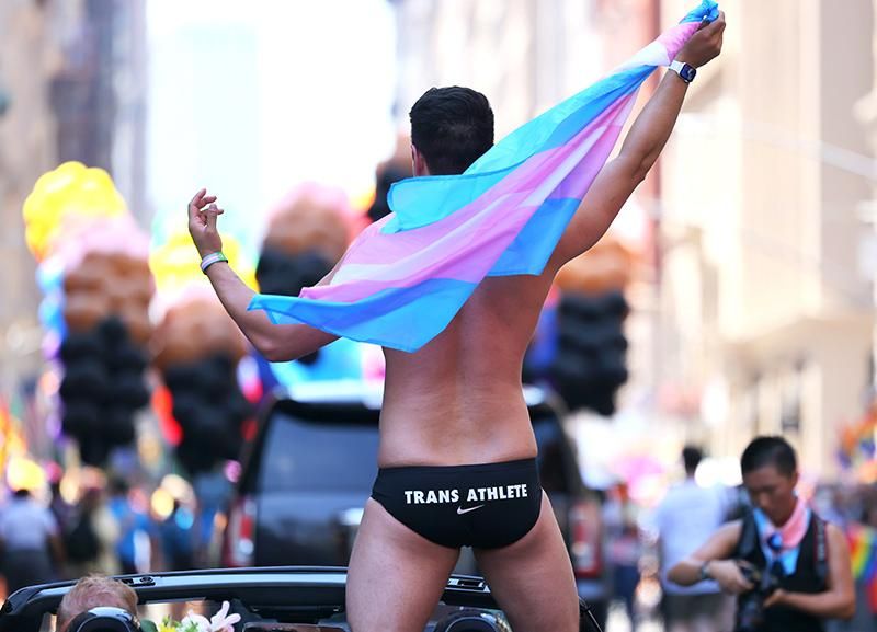 Schuyler Bailar, the first transgender athlete to compete in any sport on an NCAA Division I men’s team and NYC Pride grand marshal, waves as he participates in the New York City Pride Parade on Fifth Avenue on June 26, 2022