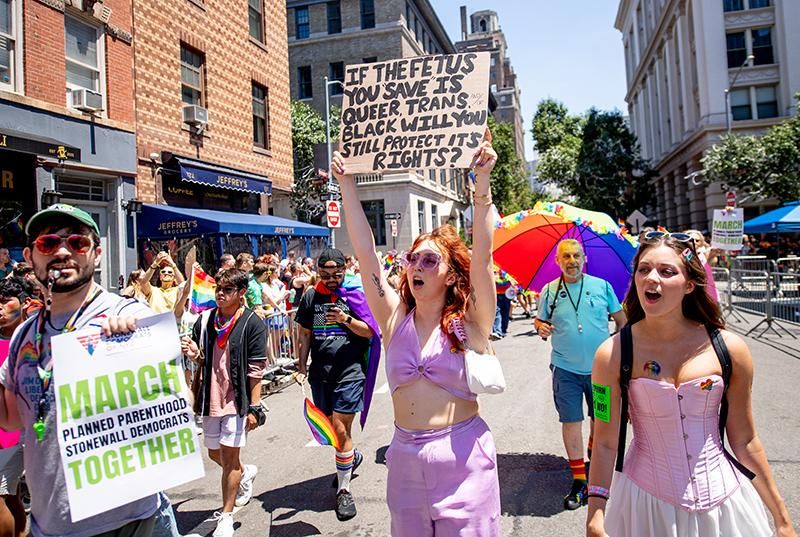 Pride march participant holds a sign during in NYC on June 26, 2022, after the US Supreme Court overturned the Roe v. Wade decision ending federal abortion protection
