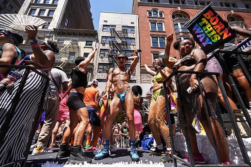 Participants dance on a float during the New York City Pride Parade on June 26, 2022