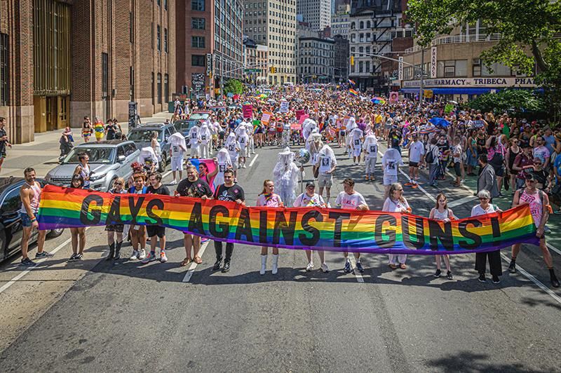 Participants seen holding a banner at the Reclaim Pride Coalition's (RPC) fourth annual Queer Liberation March. This year the march highlighted Trans and BIPOC Lives, Reproductive Justice, and Bodily Autonomy.