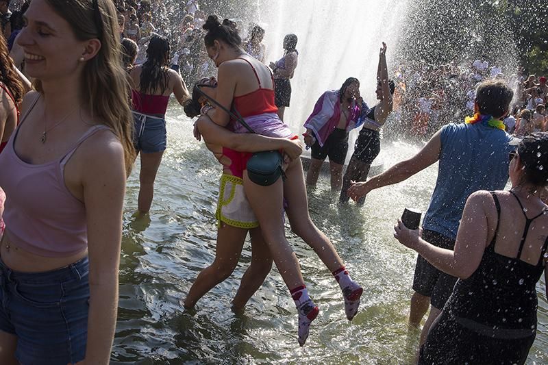 People playing in the fountain at Washington Square Park in Greenwich Village during Pride Weekend in New York City
