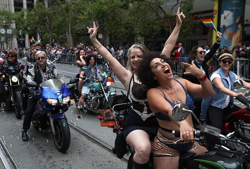 The motorcycle group Dykes on Bikes ride down Market Street during the 52nd Annual San Francisco Pride Parade and Celebration on June 26, 2022