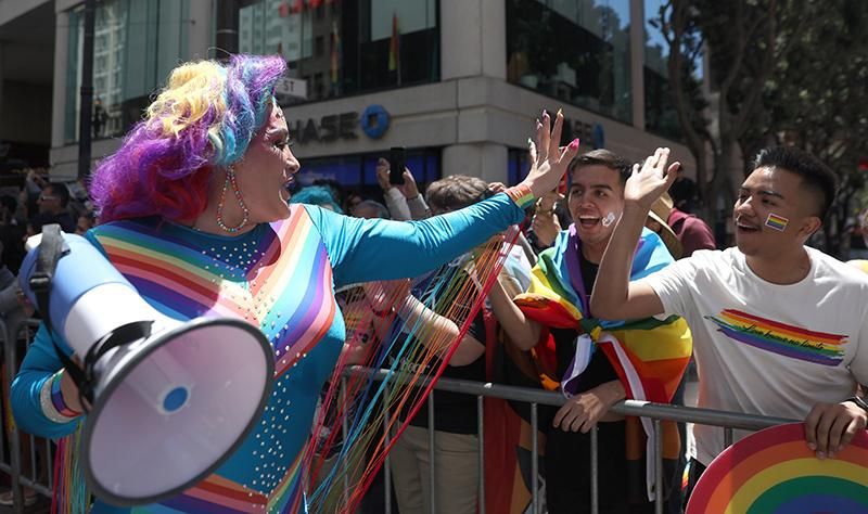 A marcher greets parade goers during the 52nd Annual San Francisco Pride Parade and Celebration on June 26, 2022