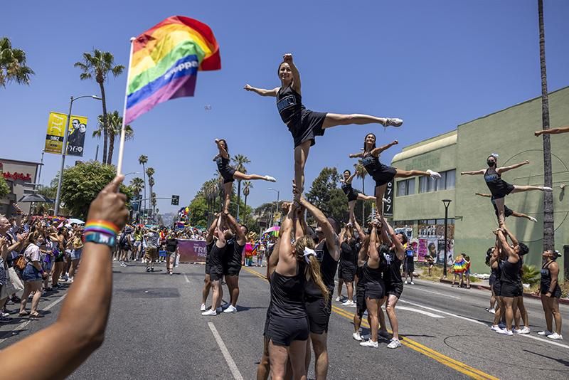 Cheerleaders with Cheer LA participate in the annual Pride Parade on June 12, 2022 in the Hollywood section of Los Angeles, California