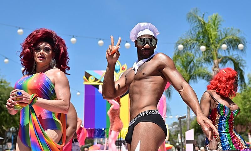 Performers ride a float in the city of West Hollywood's Pride Parade on June 05, 2022