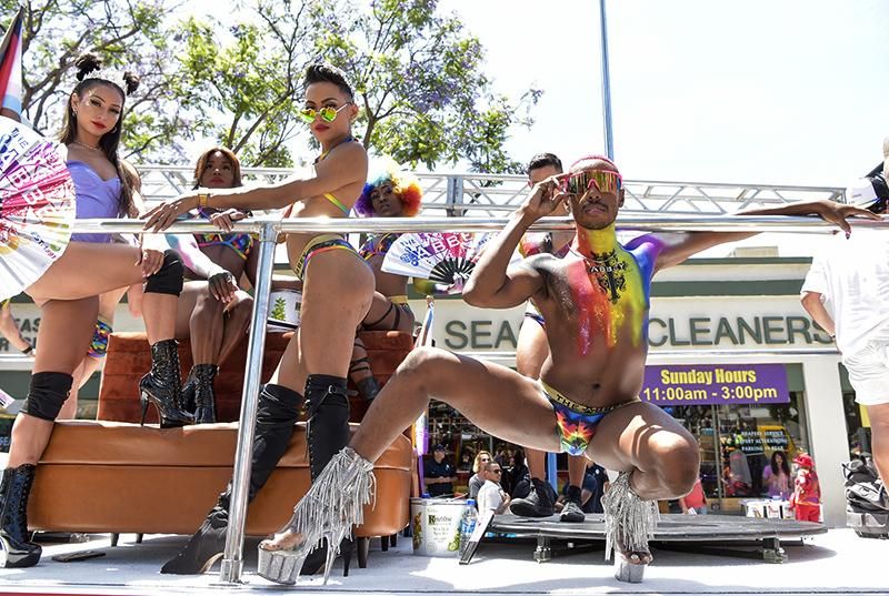 Attendees pose for portrait atop parade float at The City Of West Hollywood's Pride Parade on June 05, 2022