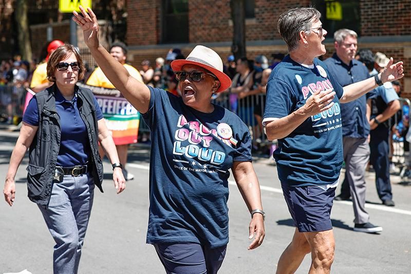 Chicago Mayor Lori Lightfoot (middle) and Chicago's First Lady Amy Eshleman (right) attend the 51st LGBTQ Pride Parade in Chicago, Illinois, on June 26, 2022