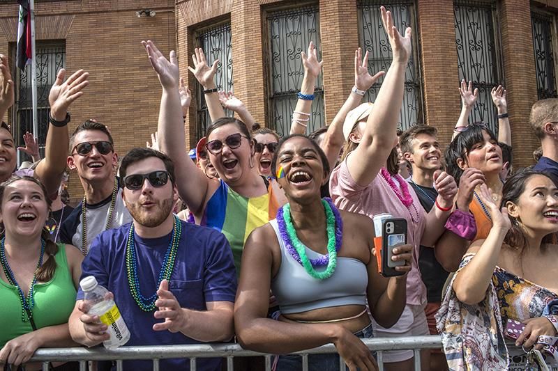 People along the roadside as they gather to celebrate the annual LGBTQ Pride Parade in Washington DC on June 11. 2022
